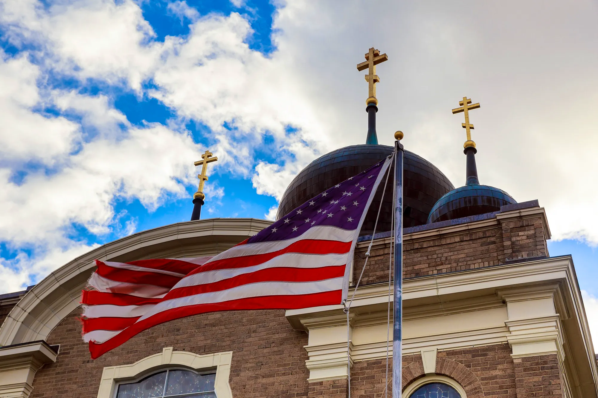 God Bless America American flag and church steeple church sky American Flag